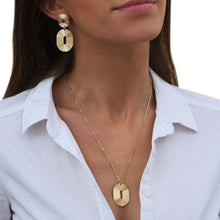 Load image into Gallery viewer, Statement Gold Oval gold necklace from Lovely Day Jewellery. Worn with matching oval gold earrings.